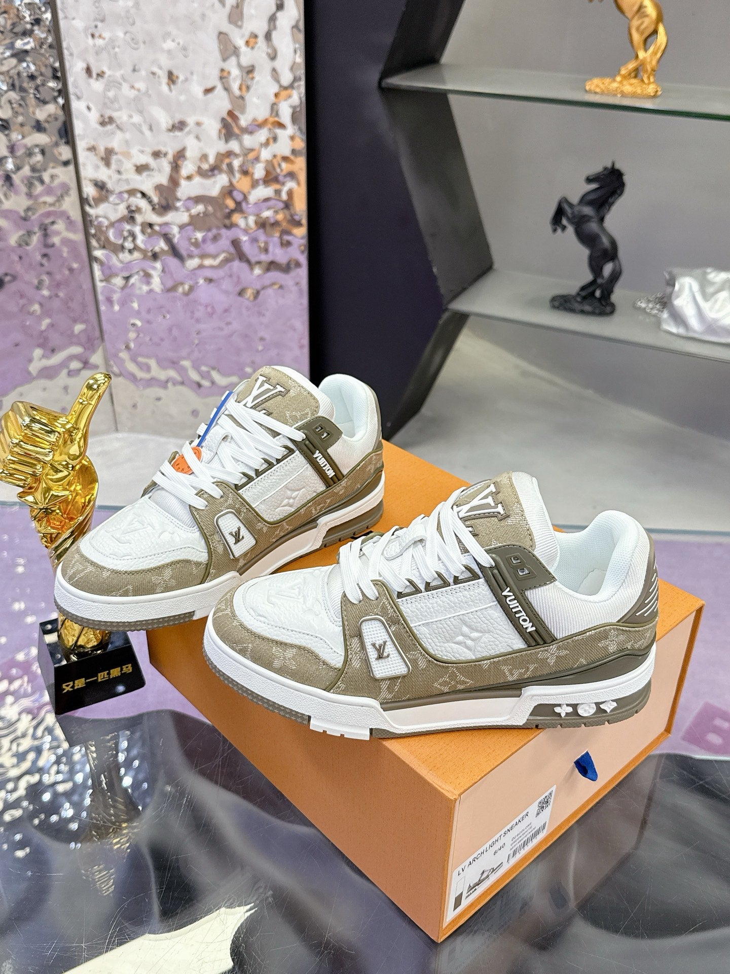 Women’s Louis Vuitton sneakers: white leather with olive overlays, lace-up front view