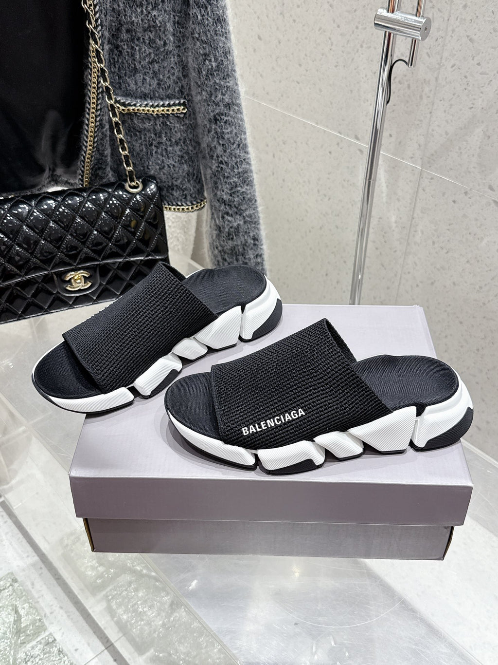 Balenciaga black slide sandals with wide elastic knit straps and white sculpted sole