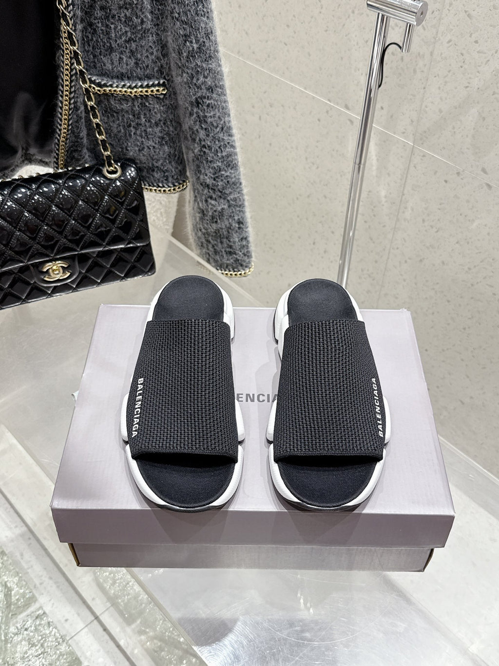 Balenciaga black slide sandals with knit straps and chunky white sole, pair