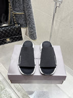 Balenciaga black slide sandals with knit straps and chunky white sole, pair