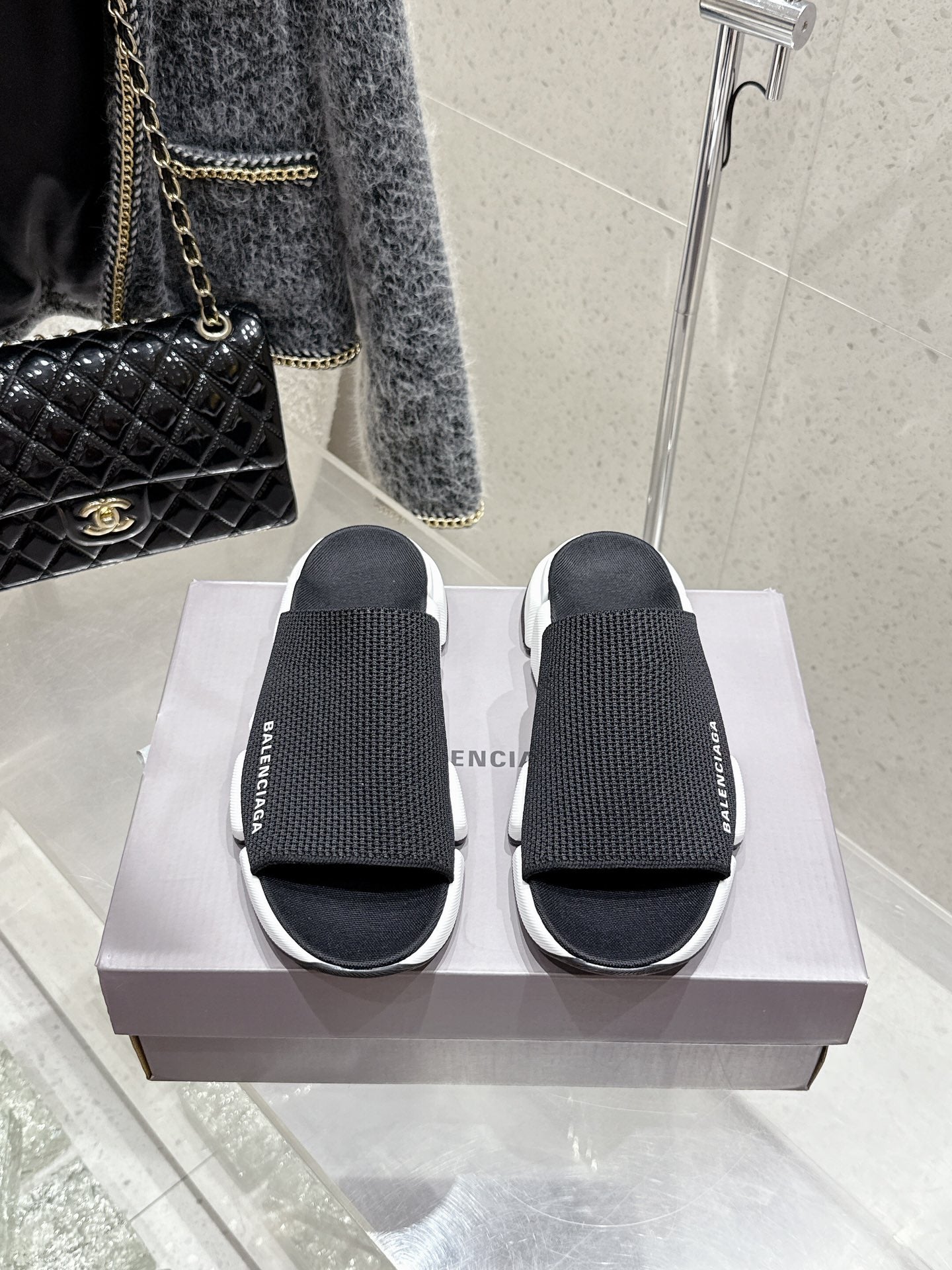 Balenciaga black slide sandals with knit straps and chunky white sole, pair