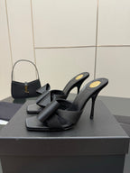 YSL black high-heel mule sandals with bow detail and open sides, pair on box