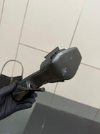 YSL black high-heel mule sandal, side view with small emblem on outer panel