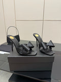 YSL black high-heel mule sandals with wide bow straps, pair on display box