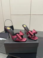 YSL pink satin bow mules with black leather upper and thin stiletto heels