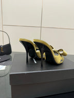 Yellow satin heeled sandals with bow detail and black soles, stiletto heel