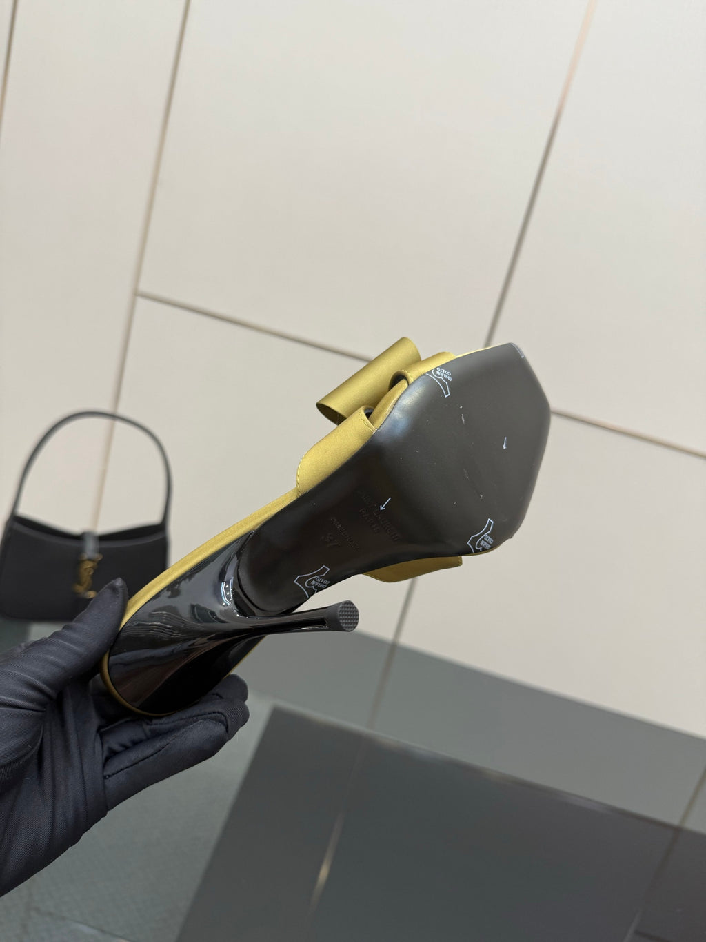 Yellow satin mule with black insole and bow; slim stiletto heel