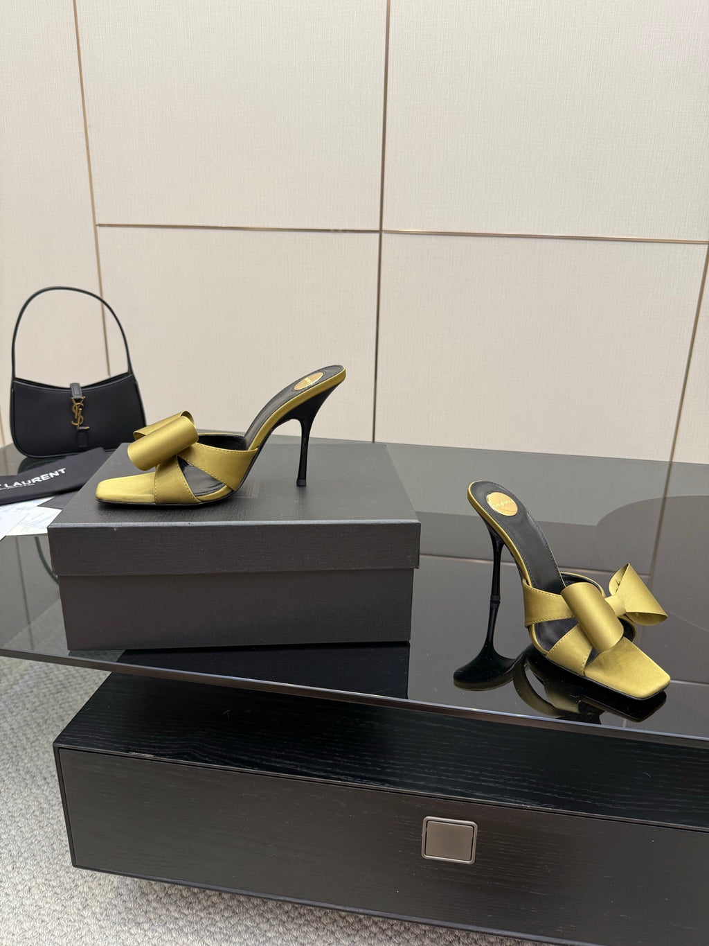 Yellow bow heeled mules on black insole with slim stiletto heel