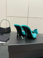 Turquoise bow mule heels with slender stiletto heel, black insole marked Saint Laurent