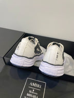 Amiri white and black lace-up sneakers, heel and back view on display