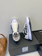 Amiri white and black lace-up sneakers, front and heel angles