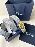 Dior belt with blue-and-white monogram strap and gold-tone engraved buckle