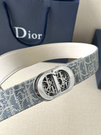 Dior belt, close-up of silver-tone buckle on blue monogram strap