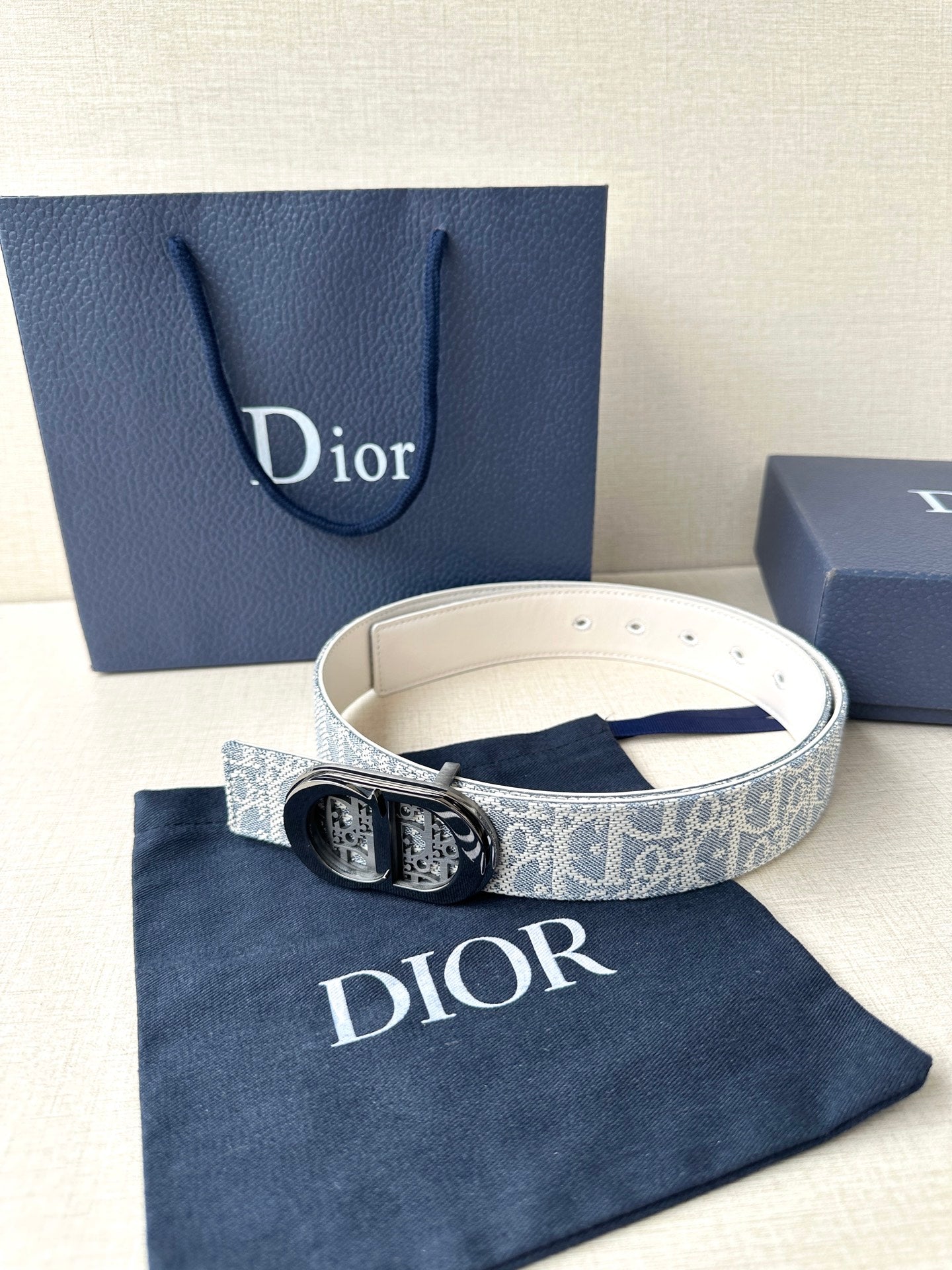 Dior belt with blue-and-white monogram strap and silver-tone buckle