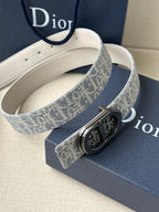 Dior belt with blue monogram strap, silver buckle, and white leather lining