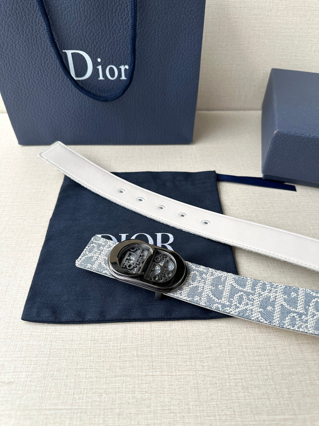 Dior belt with blue-and-white monogram strap and silver-tone buckle, white lining