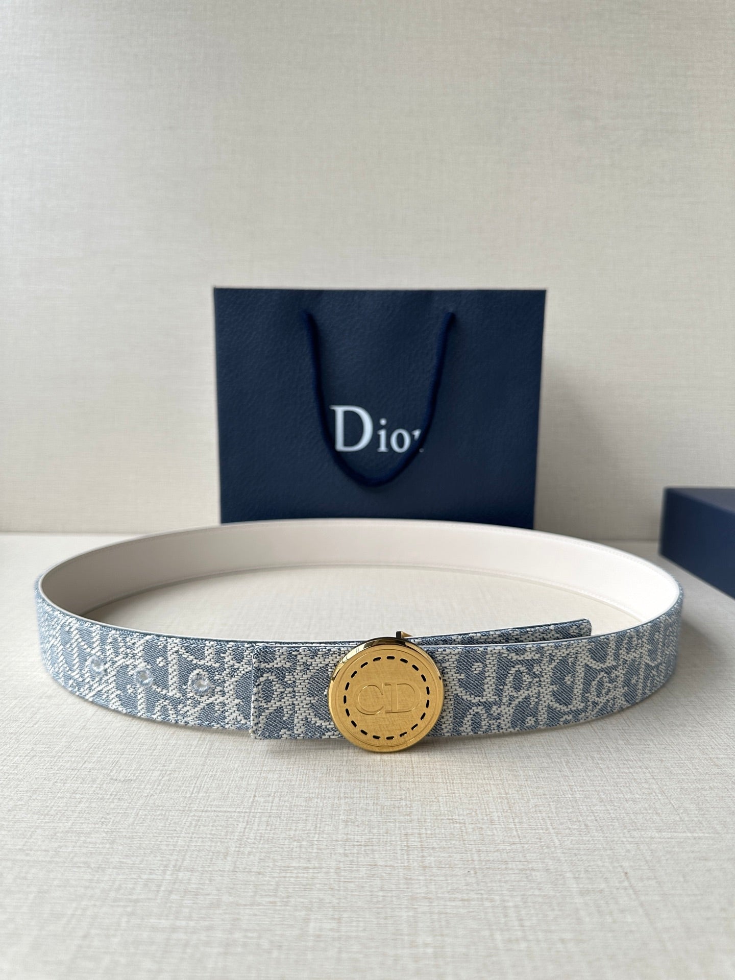 Dior monogram belt with round gold-toned buckle on blue canvas strap