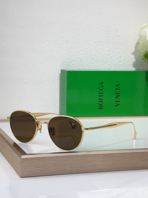 Bottega Veneta round sunglasses with gold-tone metal frame and dark brown tinted lenses