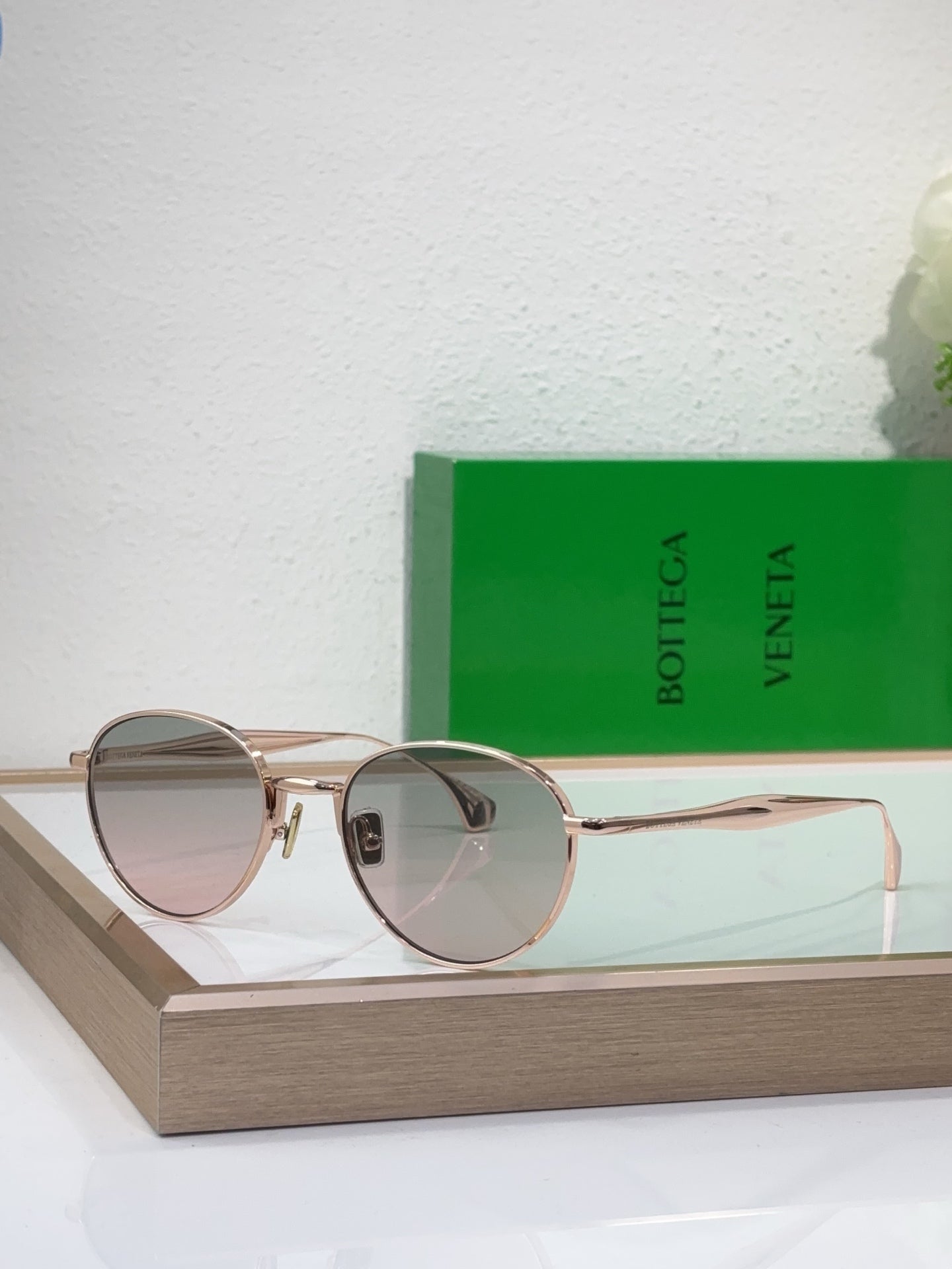 Bottega Veneta round sunglasses with gold-tone metal frame and rose-tinted lenses