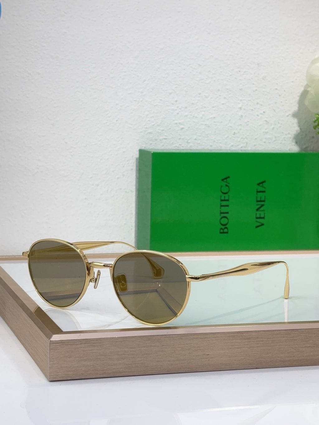 Bottega Veneta round sunglasses with gold-tone metal frame and honey amber tinted lenses