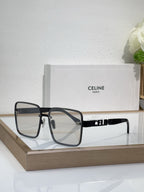Sunglasses with dark-tinted lenses and black square frame, gold rivets