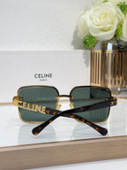 Sunglasses with tortoiseshell arms, gold-tone frame, dark tinted lenses