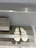 Balenciaga leather sandals in white with three buckle straps, open toe.
