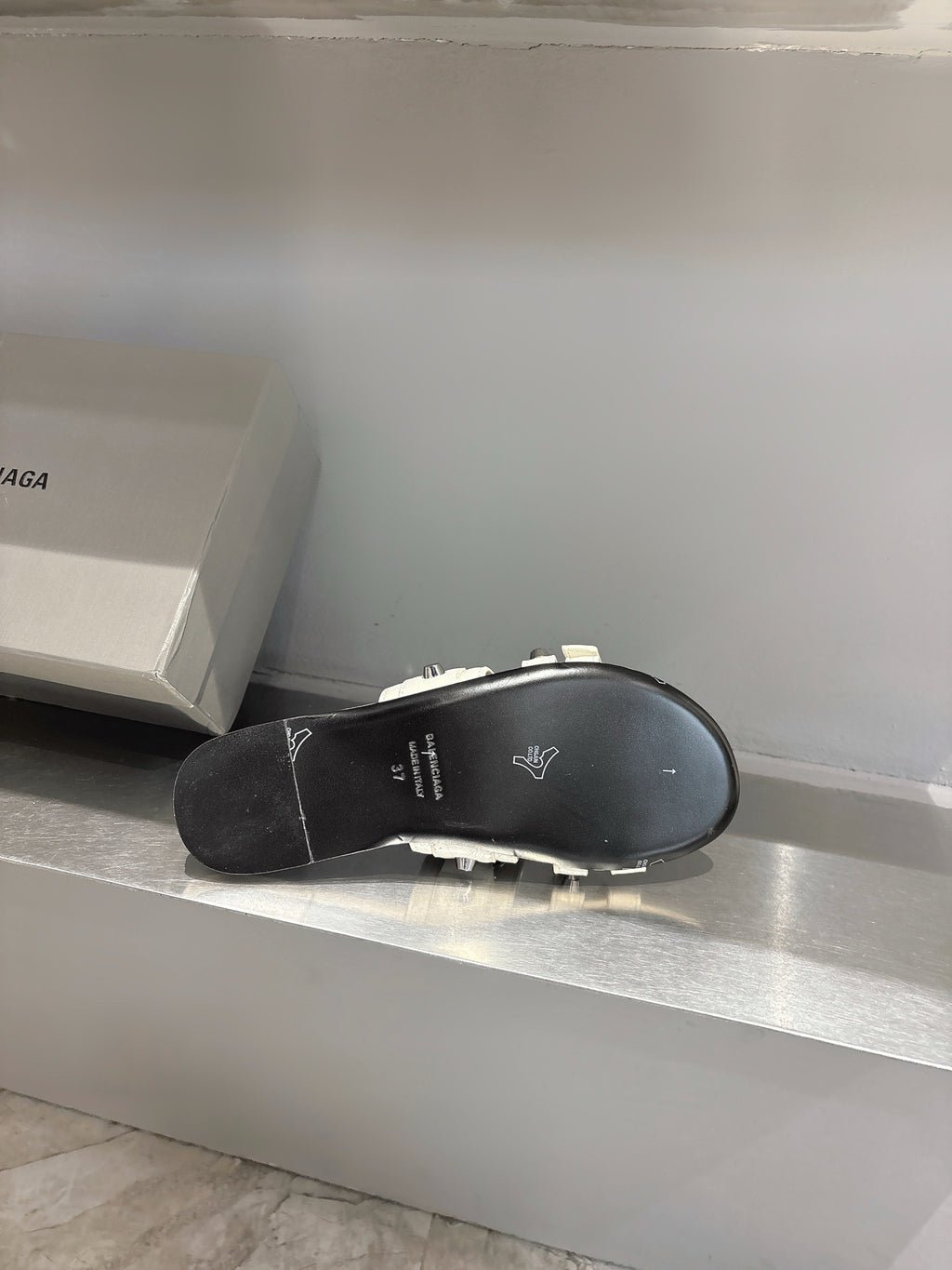 Balenciaga sandal outsole with black rubber tread, shown from underside view.