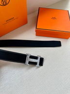 Dark leather belt strap with silver-toned H buckle detail