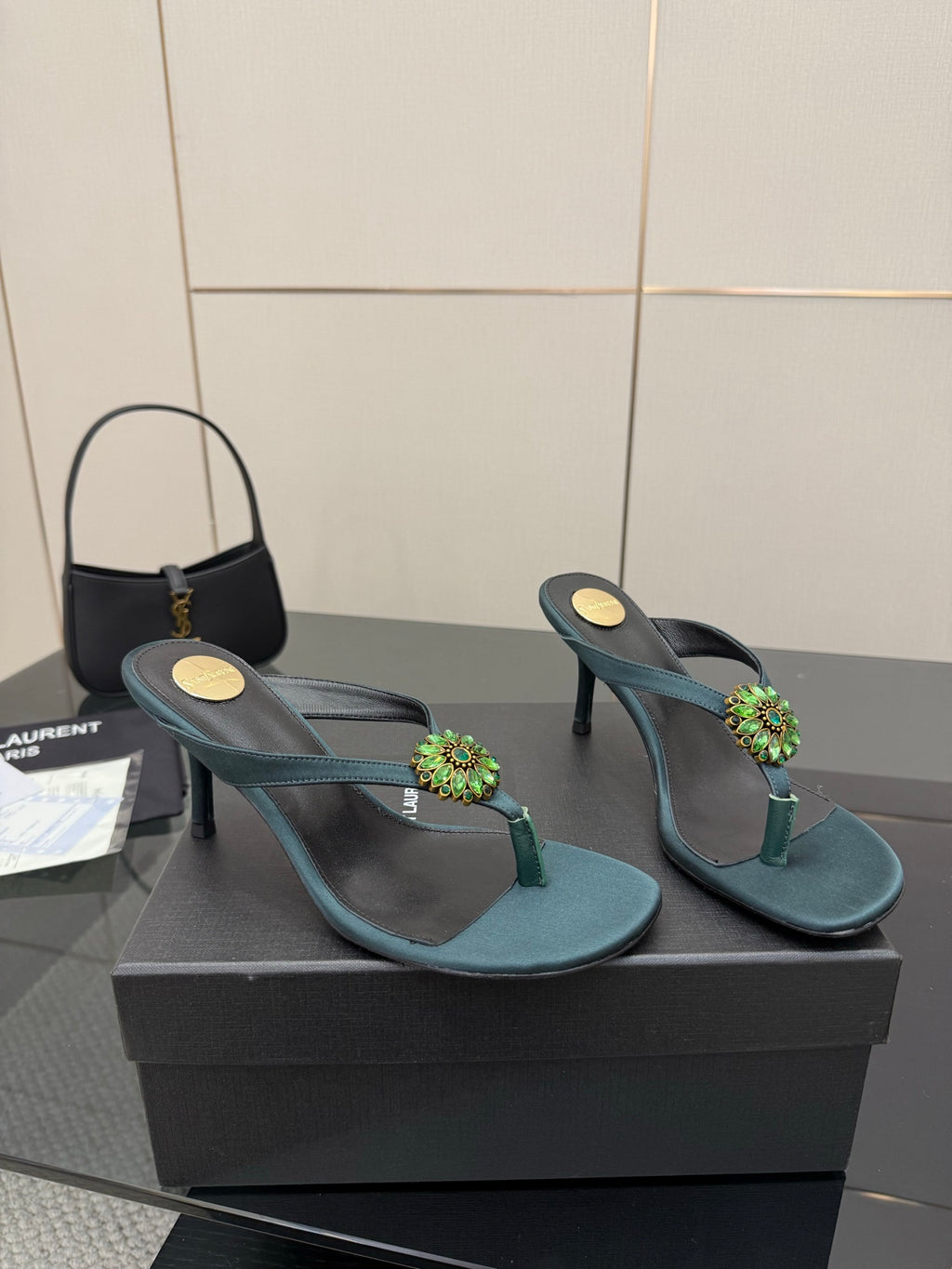 Women's teal heeled sandals with thin heel and jeweled floral strap detail