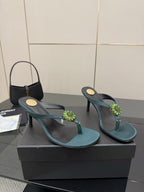 Women's teal heeled sandals with thin heel and jeweled floral strap detail