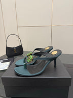 Women's teal heeled sandals with jeweled floral strap ornament and slim heel