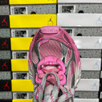 Balenciaga unisex sneaker front view with pink tongue, gray laces, and mesh-texture upper.