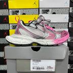 Balenciaga unisex sneakers, pink and gray upper with textured details and thick white sole.