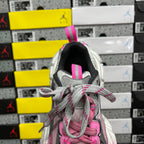 Balenciaga unisex sneakers heel view with pink pull tab and gray lace-up opening.