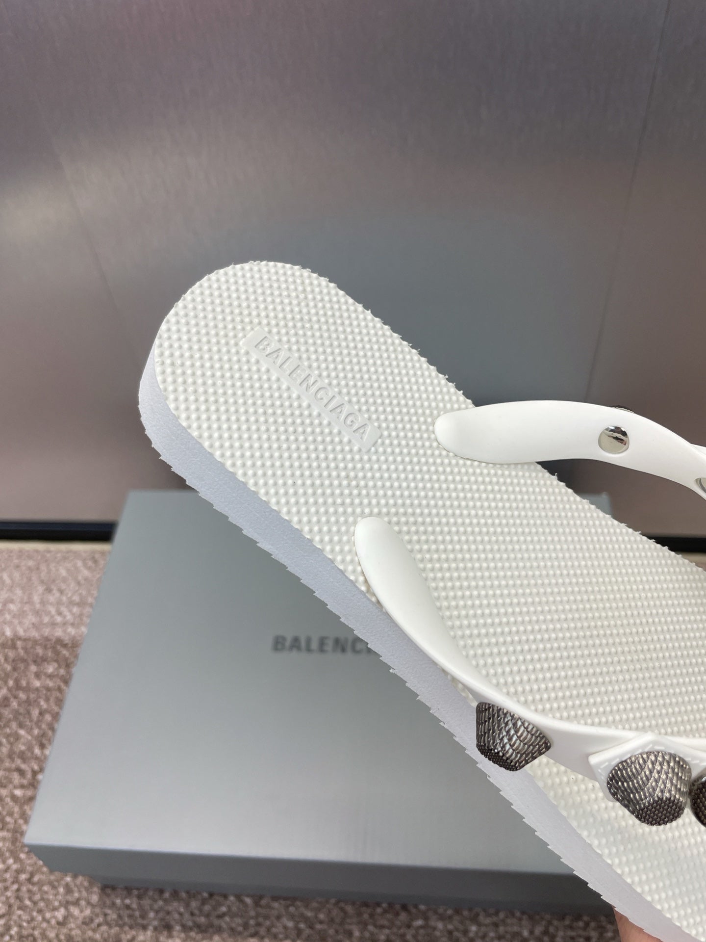 White textured thong sandal sole with sculpted toe strap and studded accents