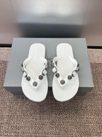 White thong sandals with studded fabric straps and silver-tone hardware