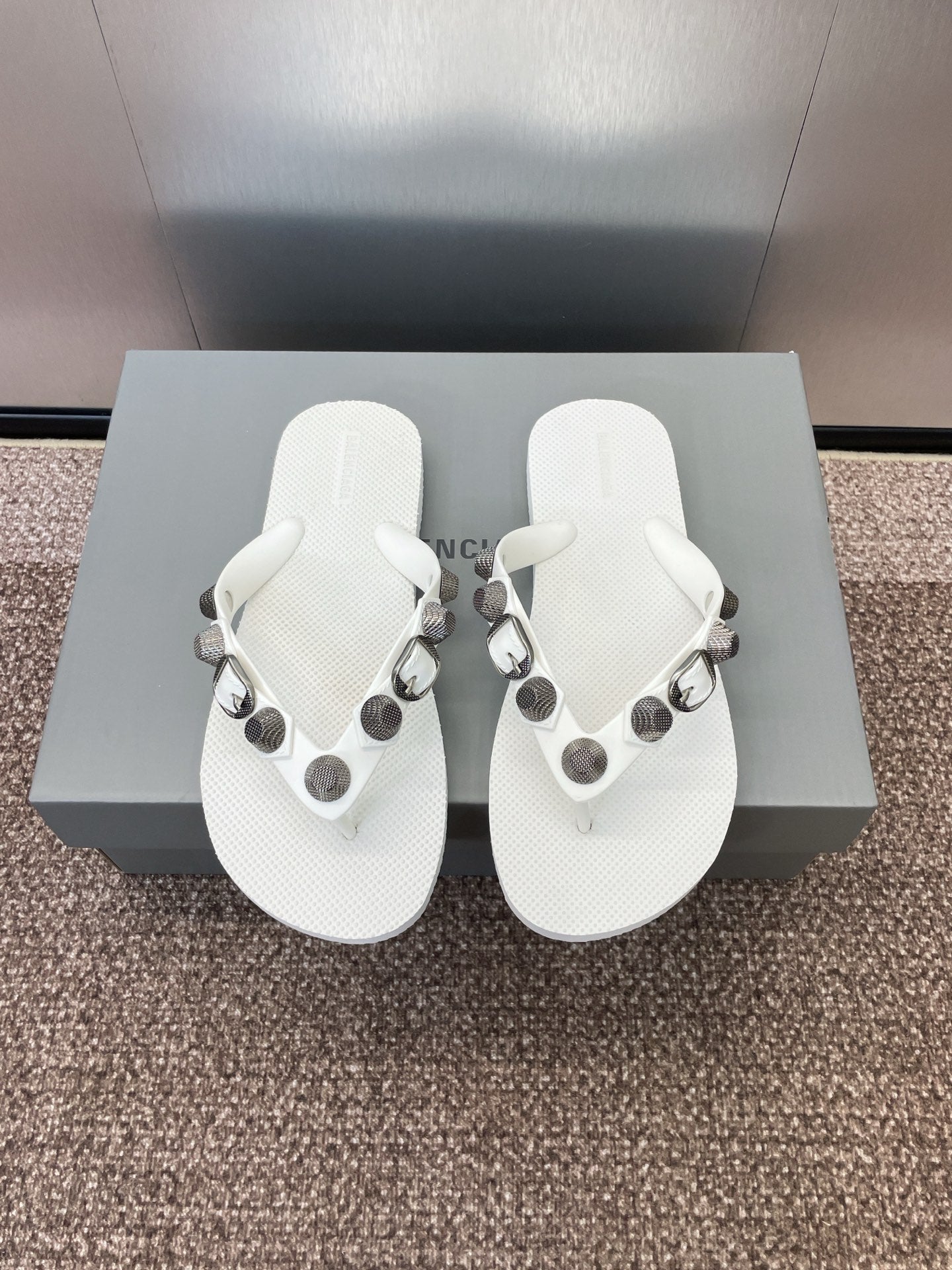 White thong sandals with studded fabric straps and silver-tone hardware