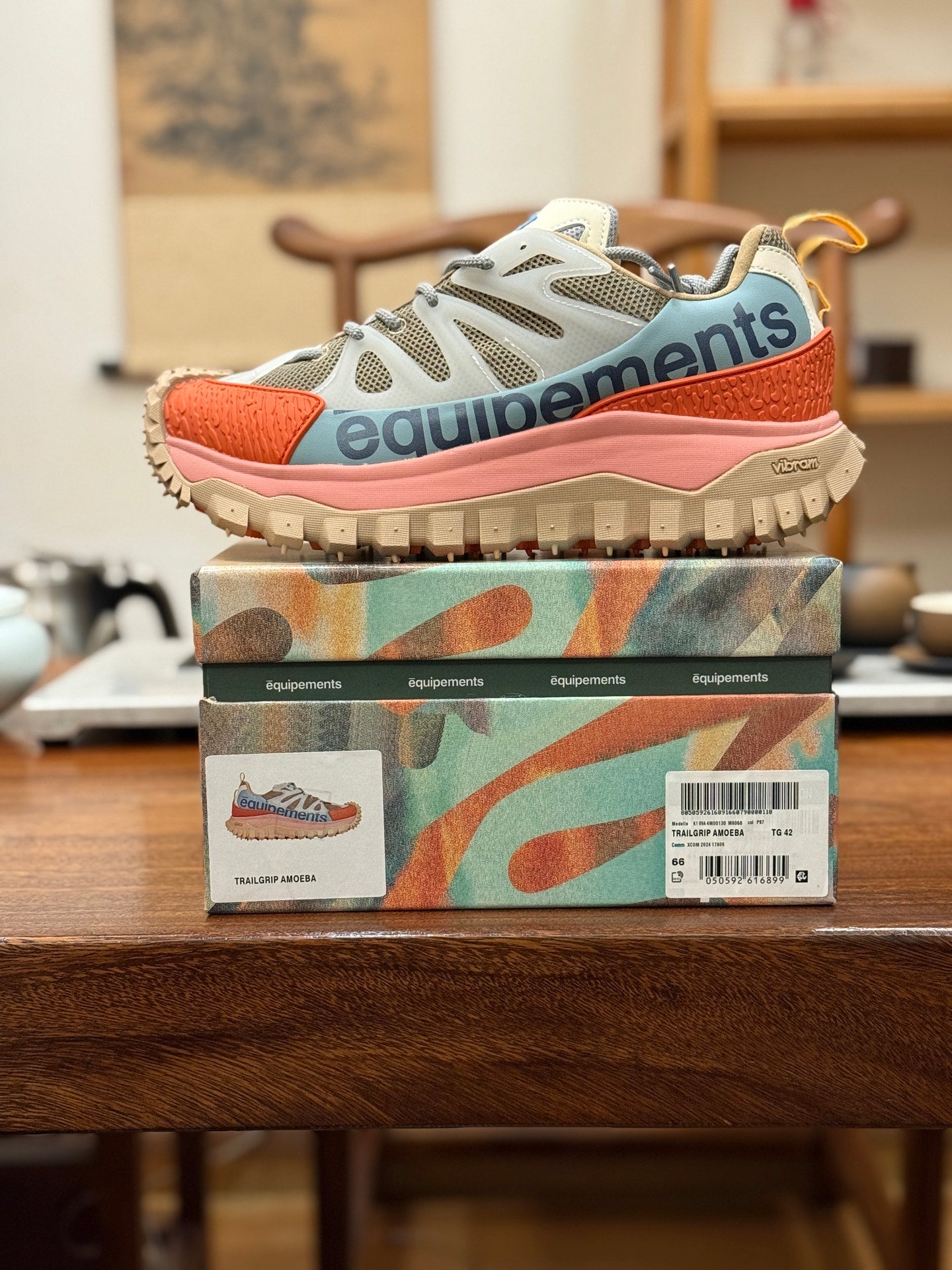 Moncler luxury sneakers in light gray mesh with orange panels, pink sole