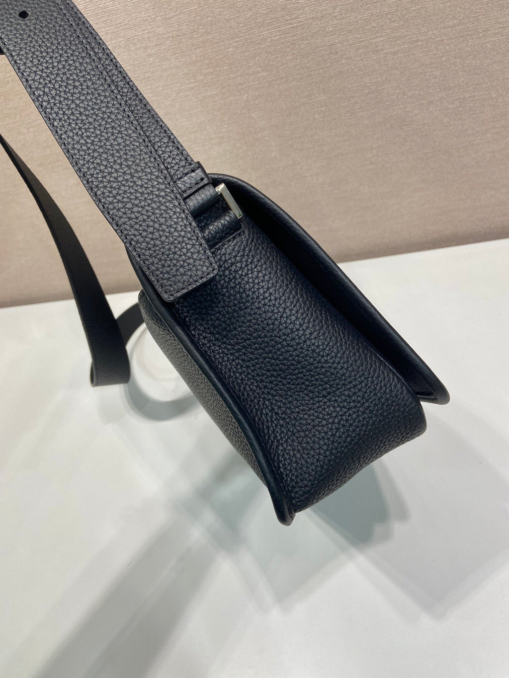 Prada textured leather shoulder bag, black, top flap and strap details