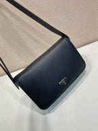 Prada leather crossbody bag with flap, black, adjustable strap, triangle logo