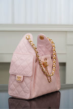 Chanel pink quilted mini bag with gold chain shoulder strap and side logo plate