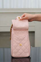 Chanel pink quilted slim bag with gold chain strap and small gold logo