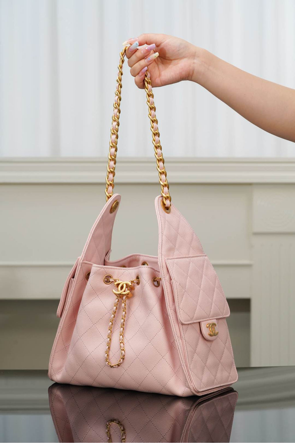 Chanel pink quilted small bag with gold chain handles and top flap