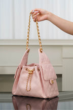 Chanel pink quilted small bag with gold chain handles and top flap
