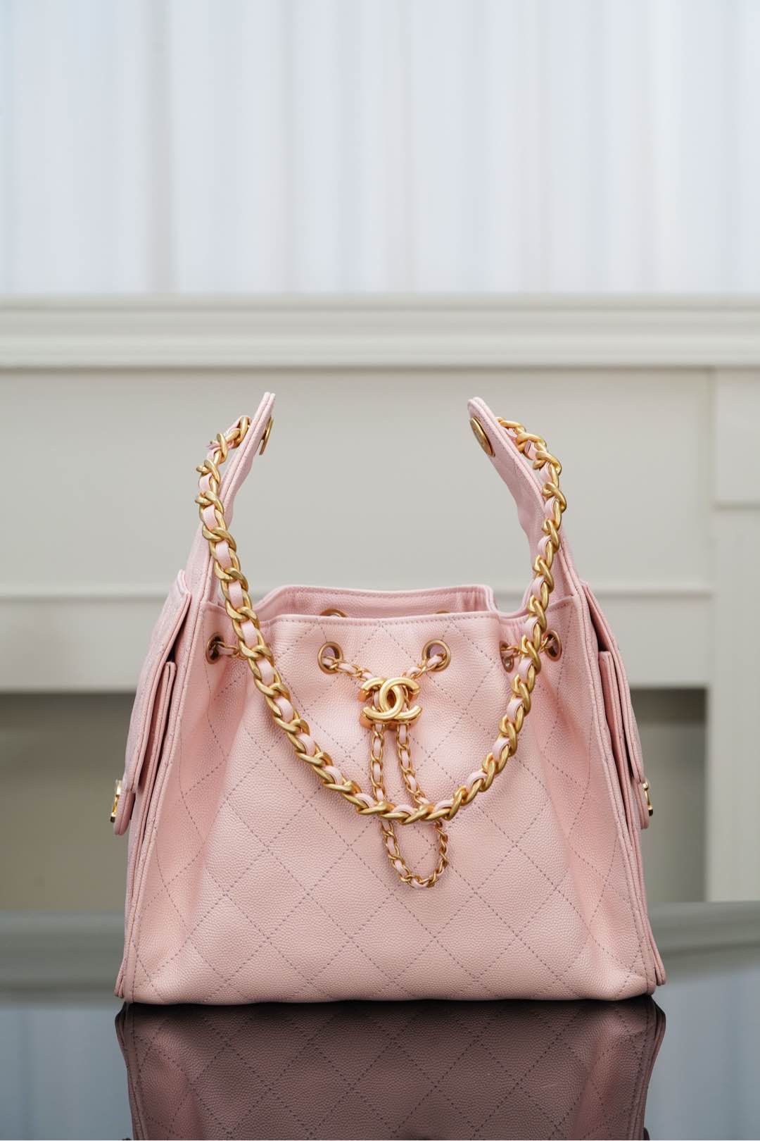 Chanel pink quilted shoulder bag with gold chain strap and front logo hardware