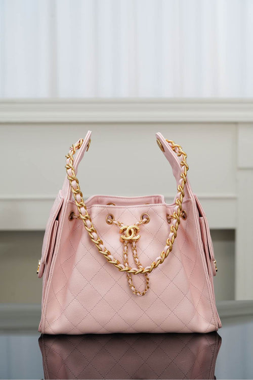 Chanel pink quilted shoulder bag with gold chain strap and front logo hardware