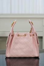 Chanel pink quilted shoulder bag with gold chain straps and top front hardware