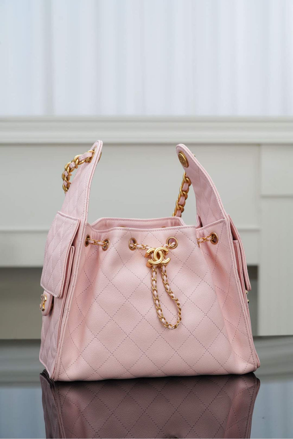 Chanel pink quilted shoulder bag with gold chain strap and front logo hardware