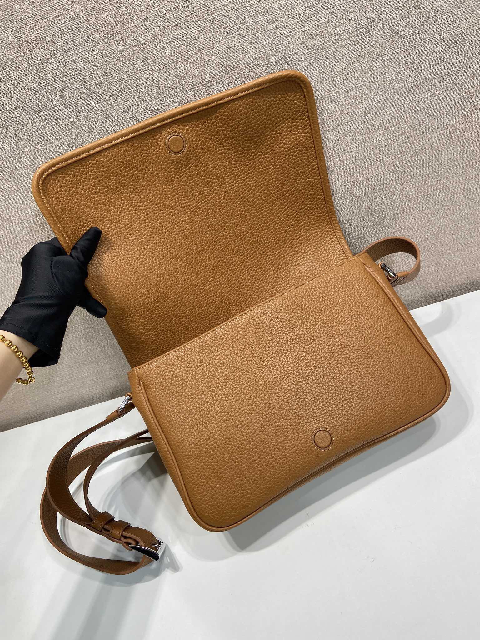 Prada leather crossbody bag, open flap with front pocket and adjustable strap